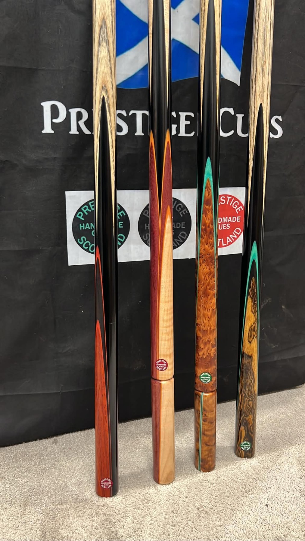 Real Prestige cues with distinctive coloured splices and wood grain